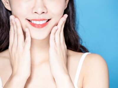 close up of asian beauty woman has healthy teeth and smile to you